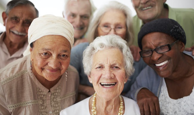 Diverse group of seniors smiling at the camera